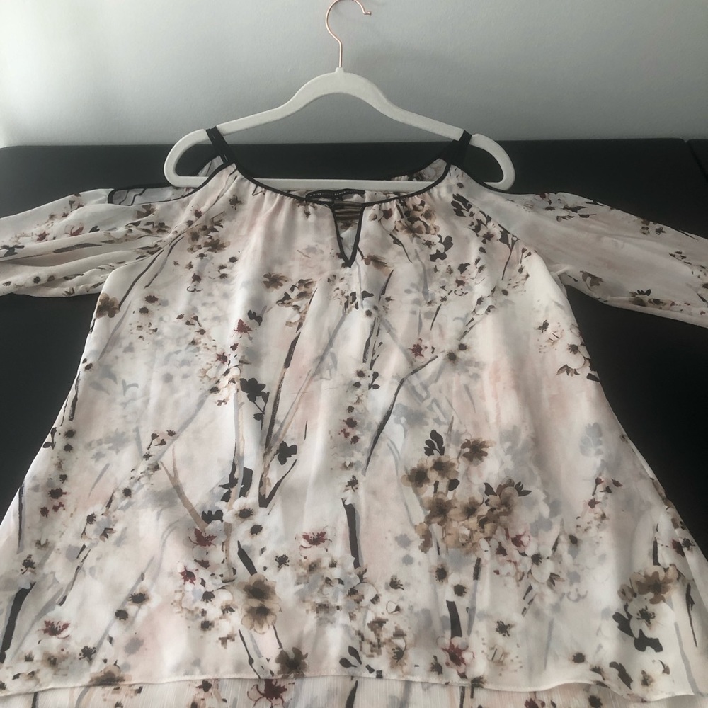 Beautiful White House Black Market shoulder revealing blouse.